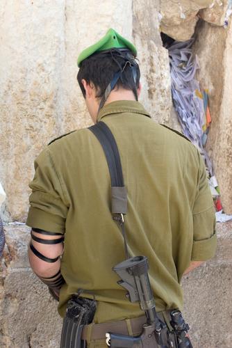 Soldier praying at the Western Wall Soldier praying at the Western Wall