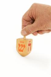the physics of dreidel spinning