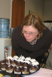 Debbie Shai blows out her candles
