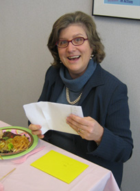 Vicki Weber reads a card from her colleagues